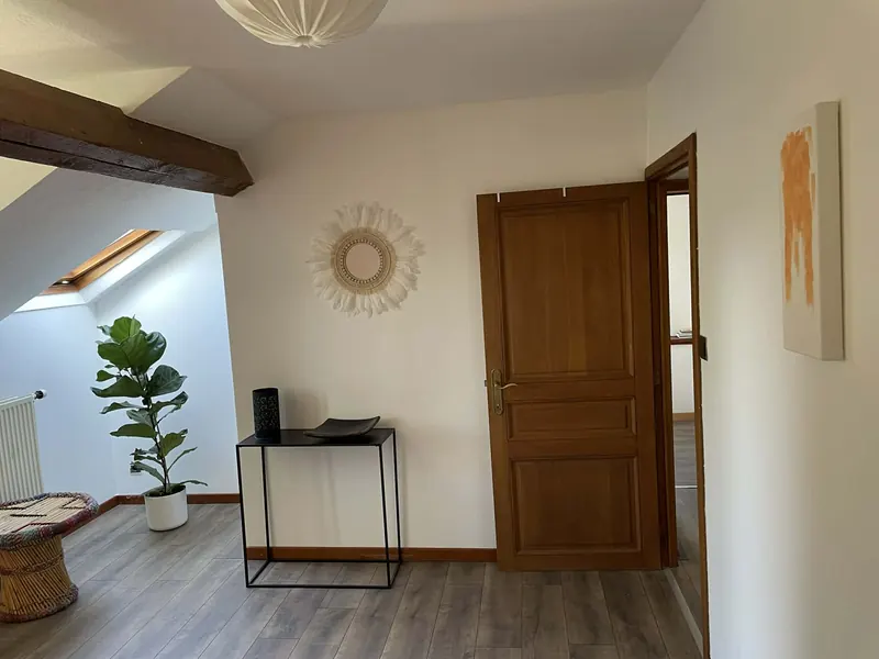 Bright corner of the master bedroom with desk and plant