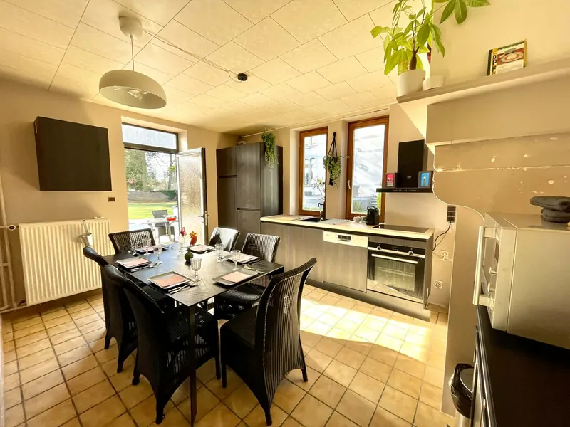 Kitchen with a dining table for six and garden view