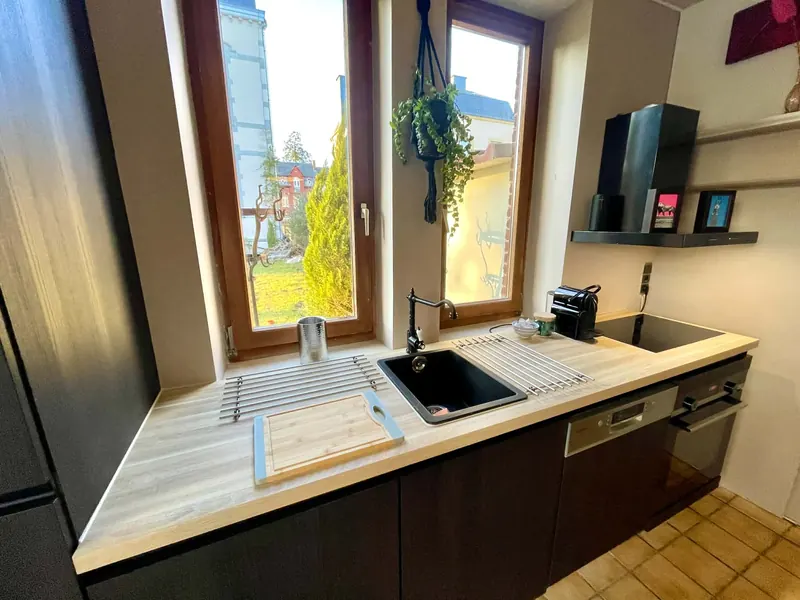 Fully equipped kitchen counter with sink and hob