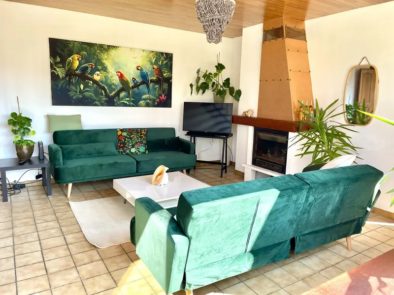 Cosy lounge corner with sofas and TV